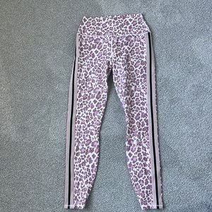 Spiritual Gangster yoga leggings. Pink cheetah print with black and gold stripe.